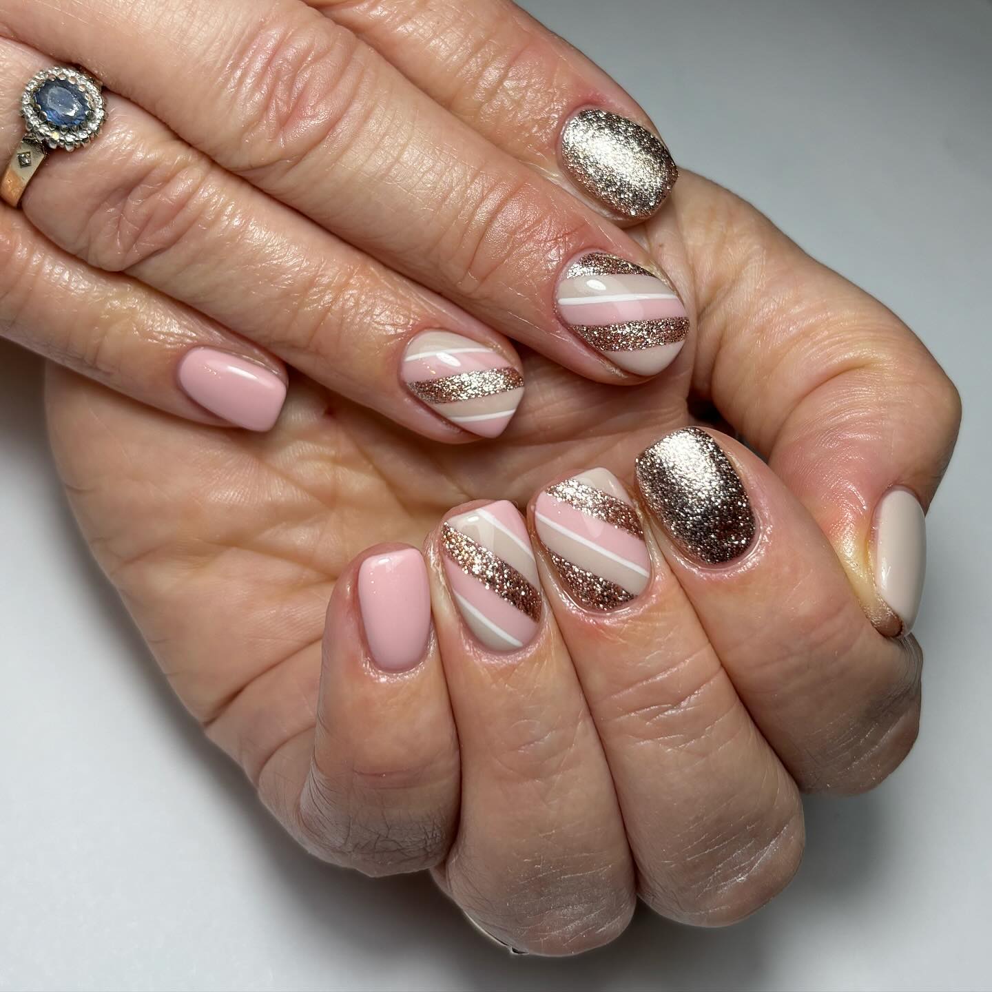 Elegant Glitter and Stripes Nail Design