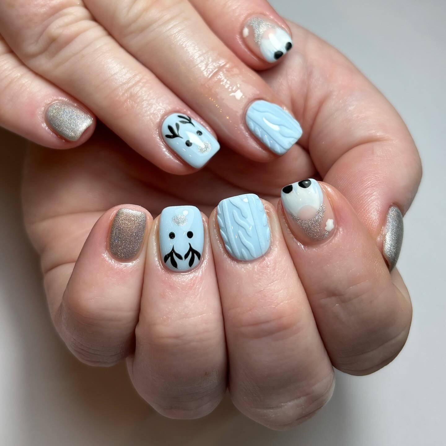 Artistic Nail Design with Blue and Silver