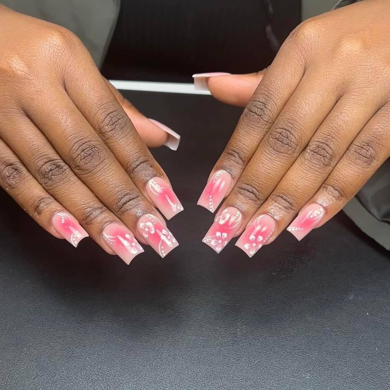 Artistic Pink Ombre Nails with Floral Design