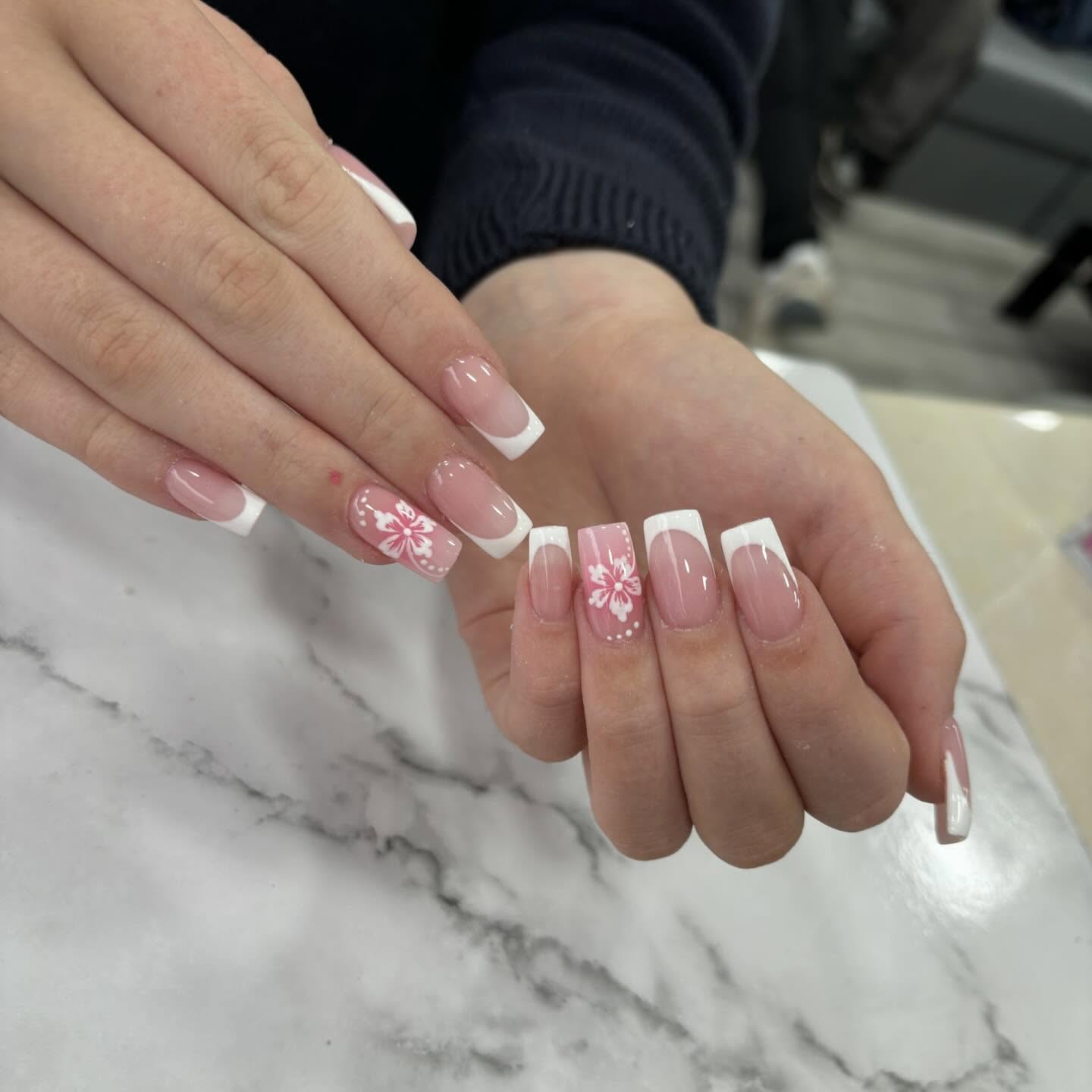 Elegant Pink and White French Nails with Floral Design