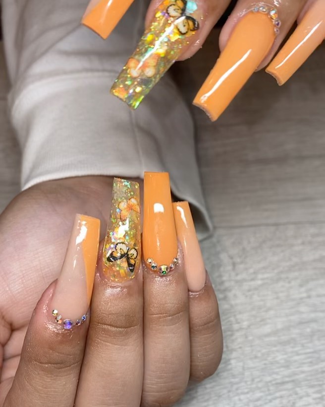 Vibrant Orange and Glittery Nails