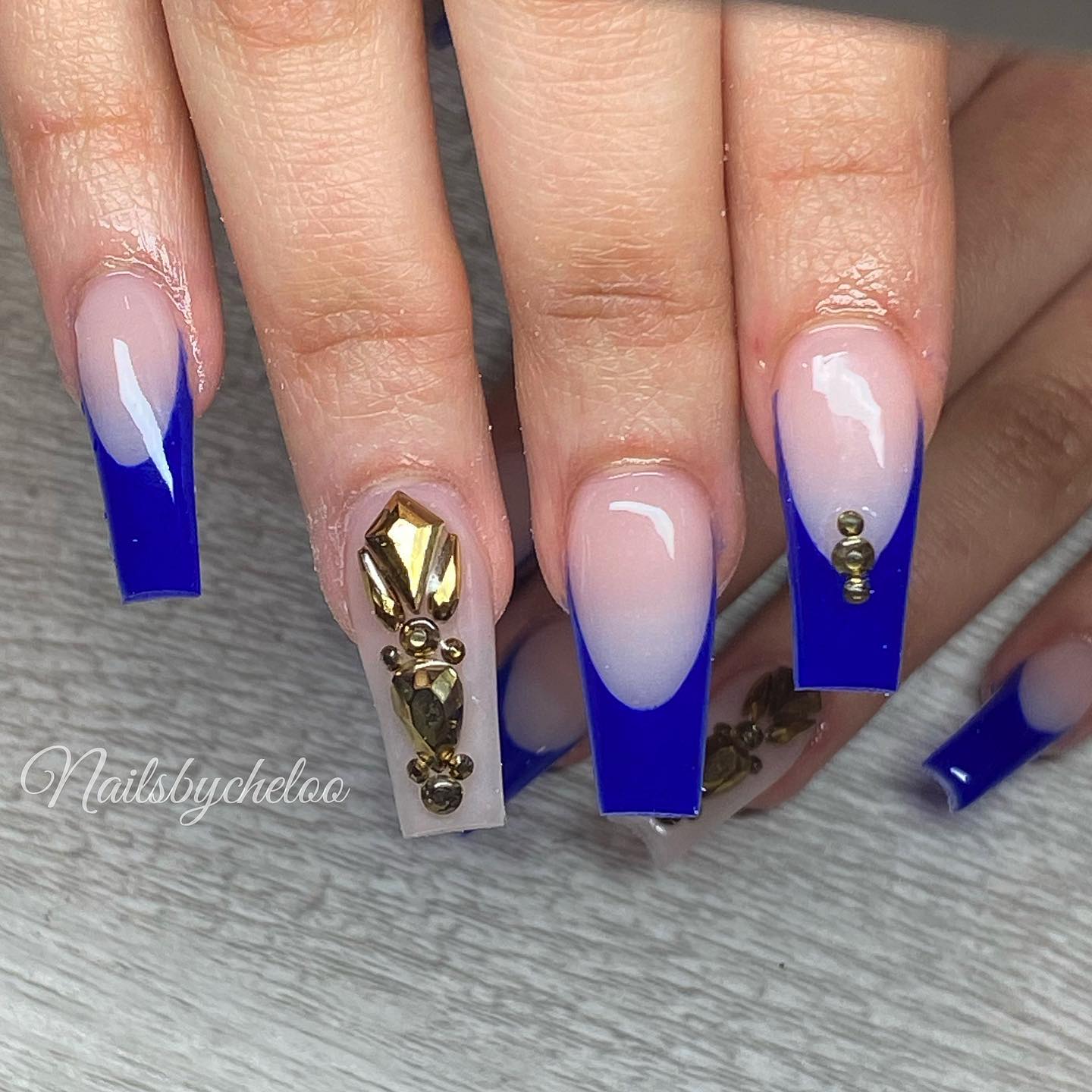 Elegant Blue Ombre Nails with Gold Accents