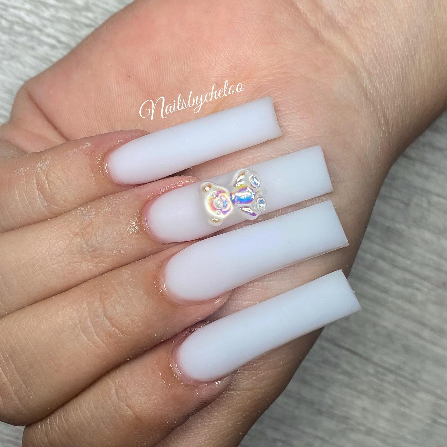 Elegant White Nails with Bow Accent