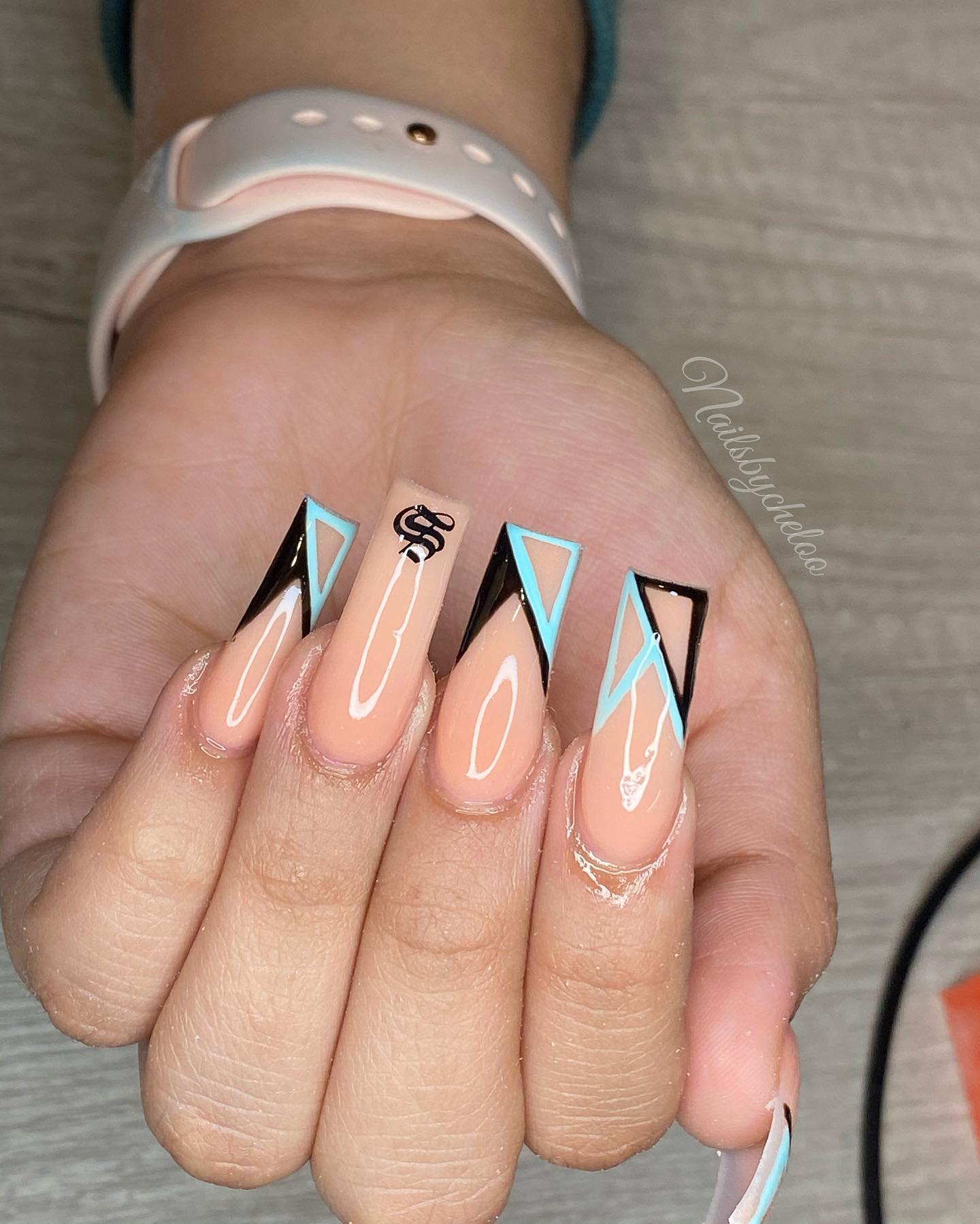 Artistic Nude and Black Nail Design