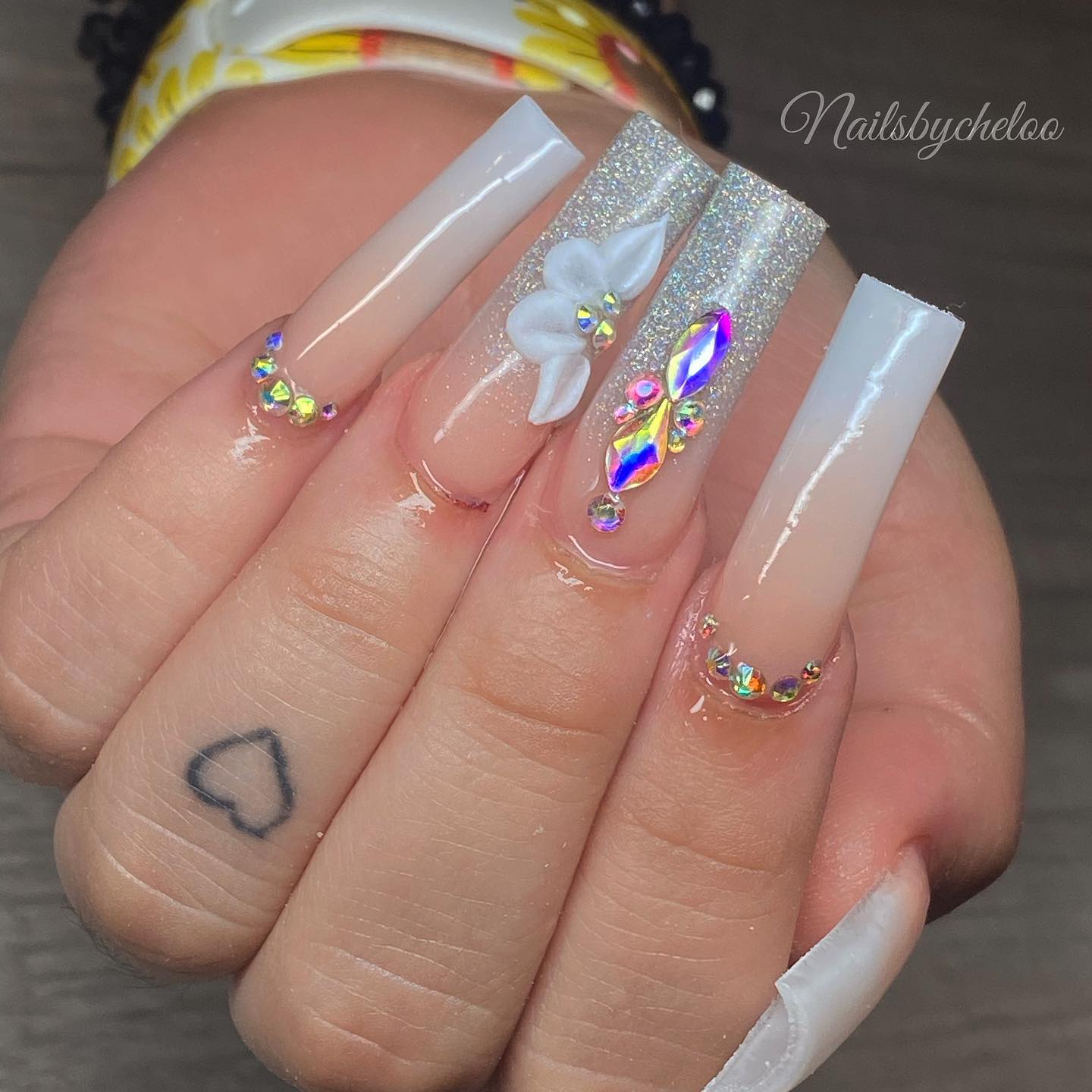 Elegant Glittered Nails with Gems