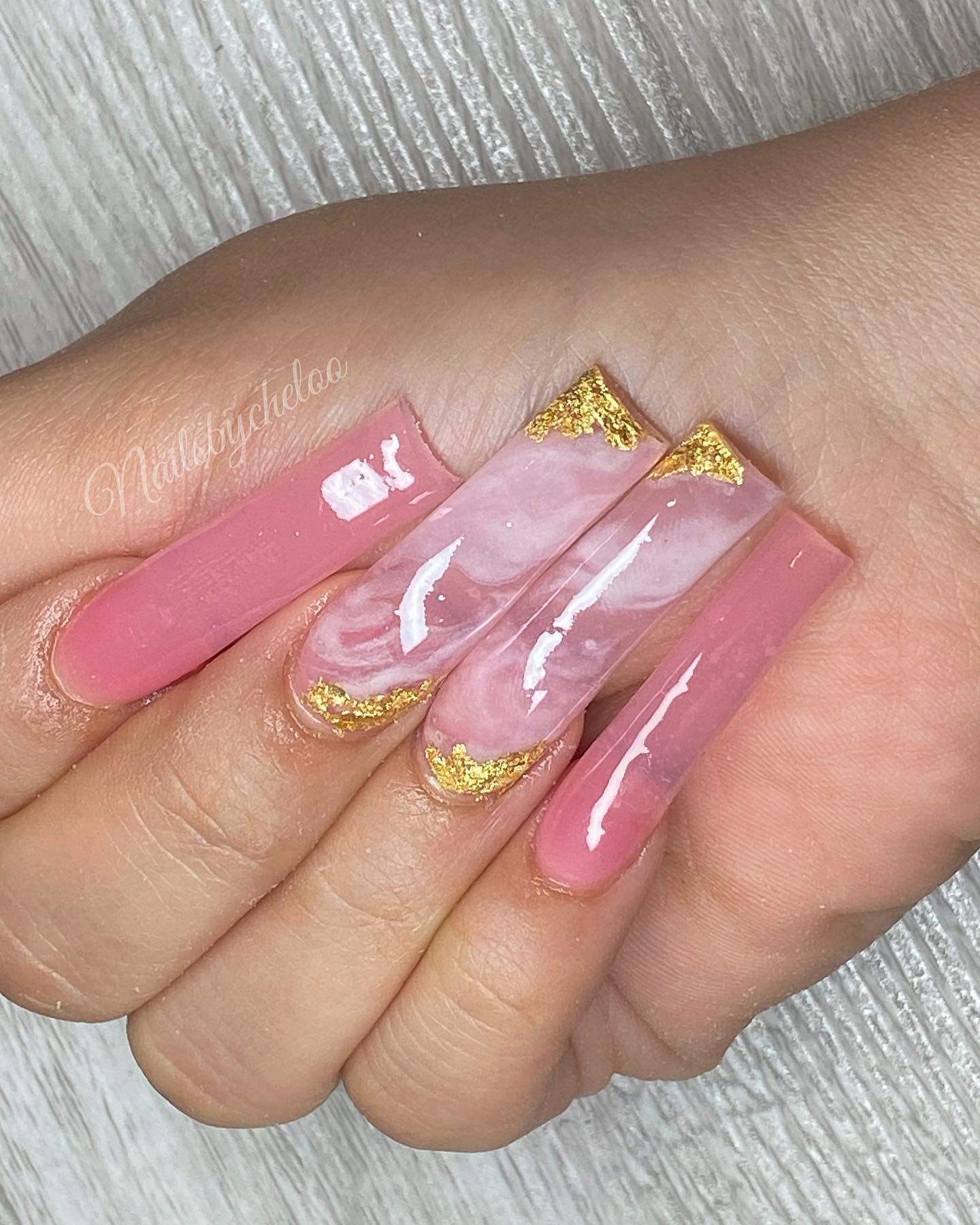Elegant Pink and Gold Marble Nails