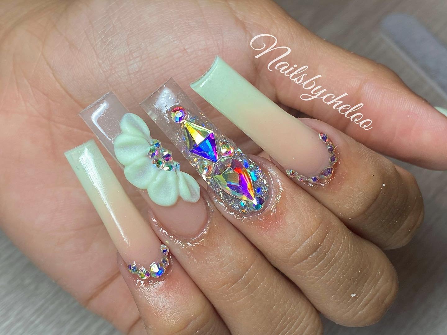 Elegant Nail Art with Gems and Flowers
