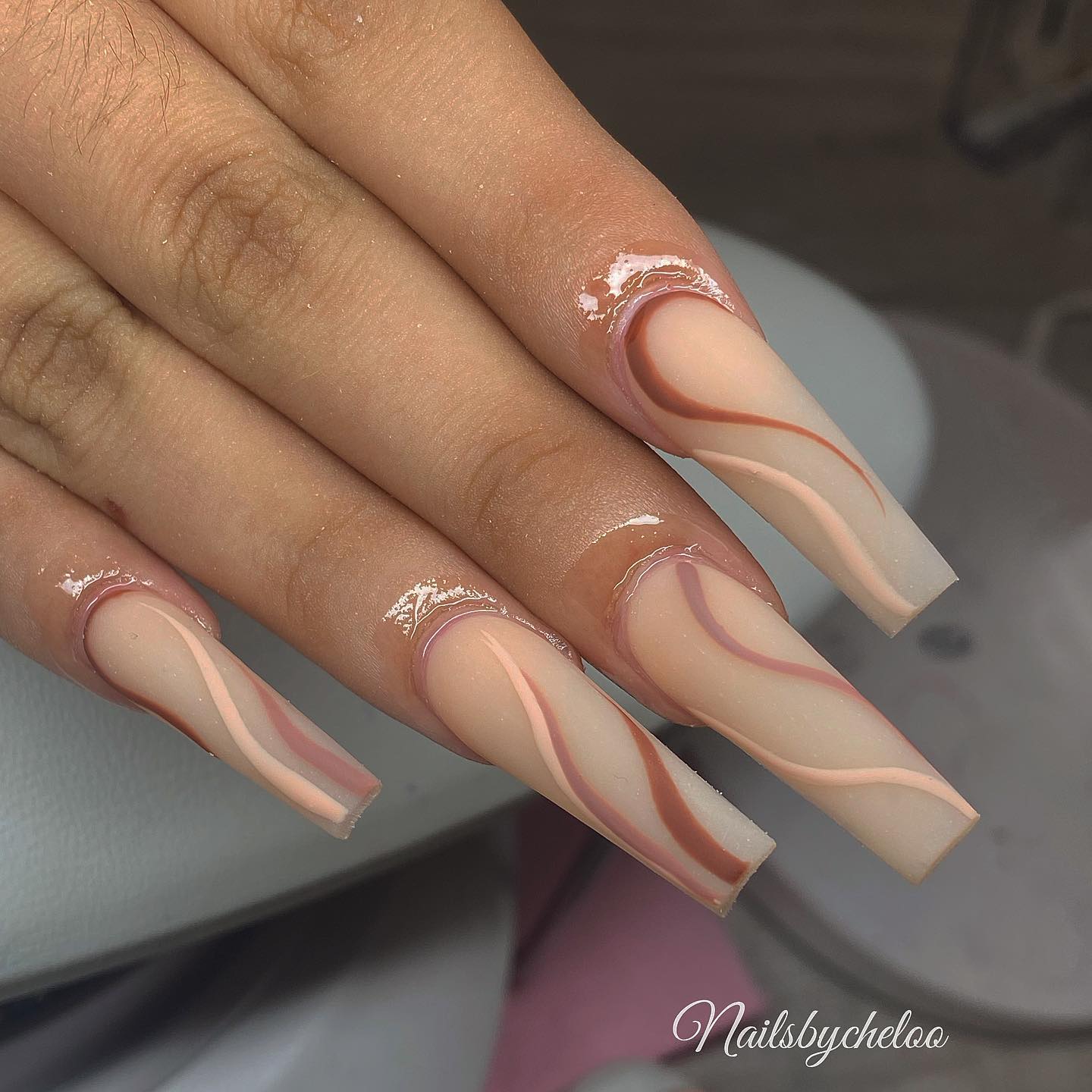 Elegant Nude and Brown Swirl Nails
