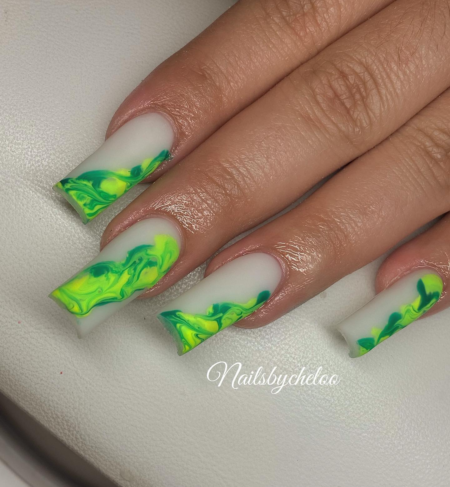 Artistic Green and Yellow Marbled Nails