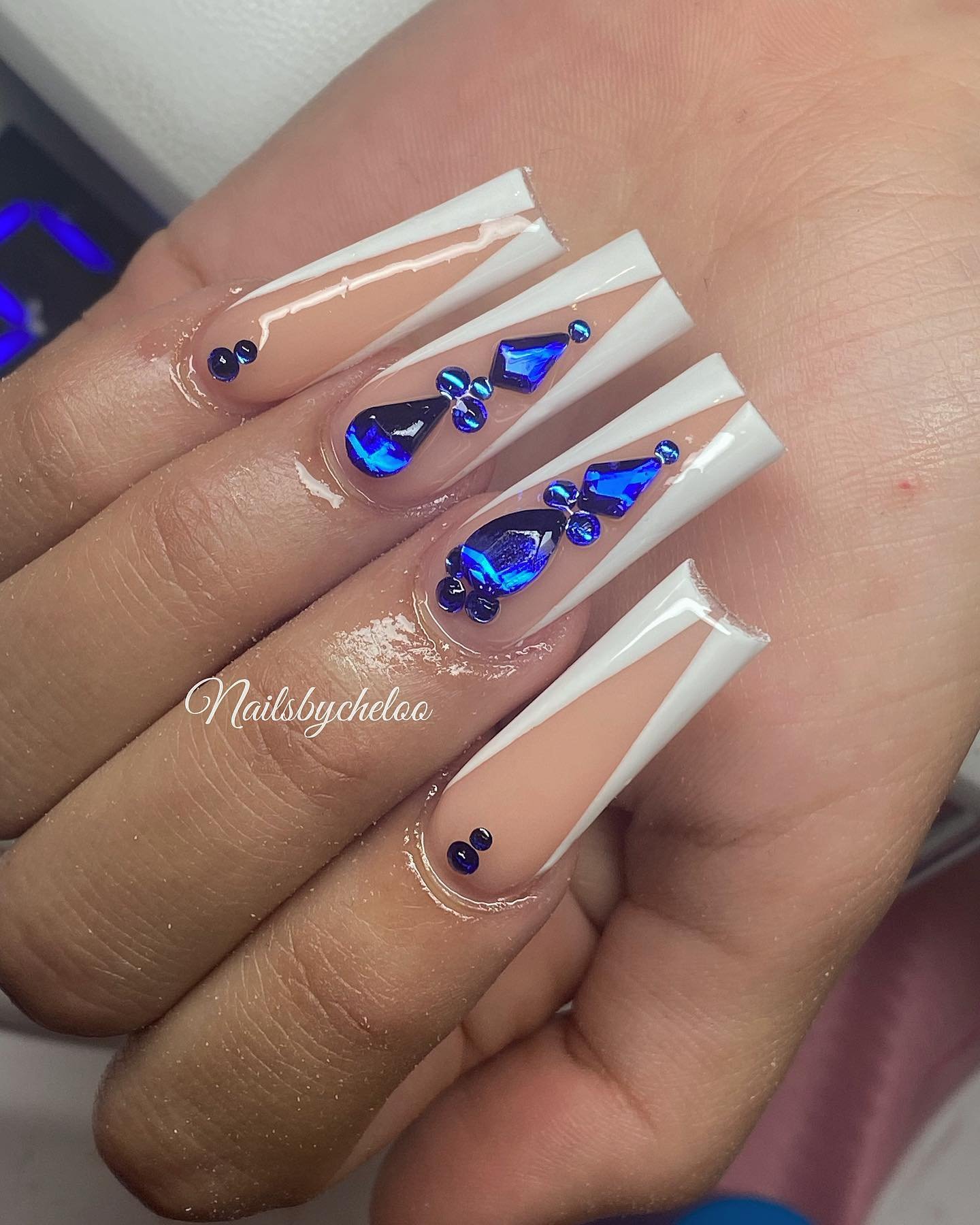 Elegant Blue Gem Nail Design