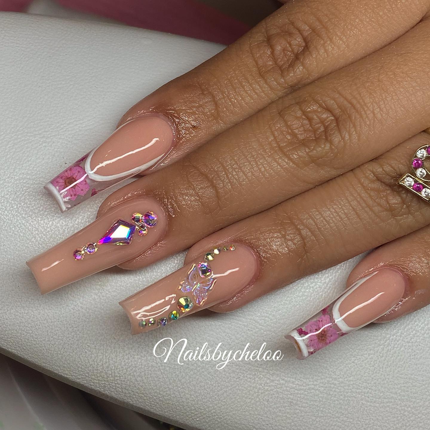 Elegant Nude and Pink Nail Design with Gems