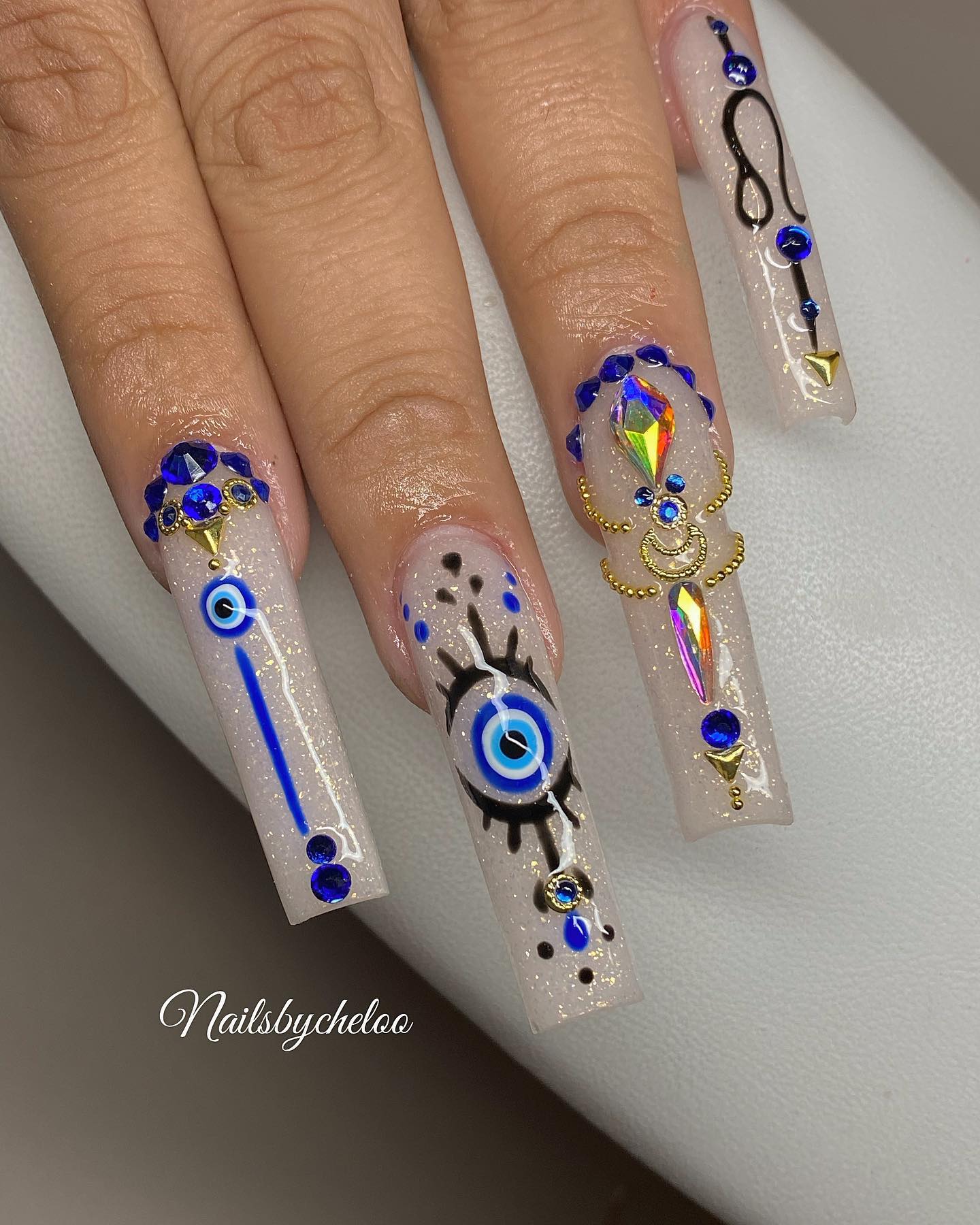 Artistic Glitter Nails with Gem Accents