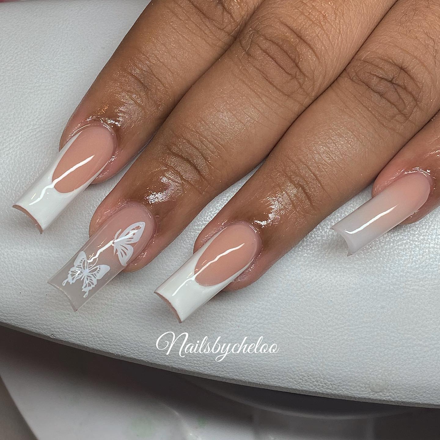 Elegant French Tip with Butterfly Design