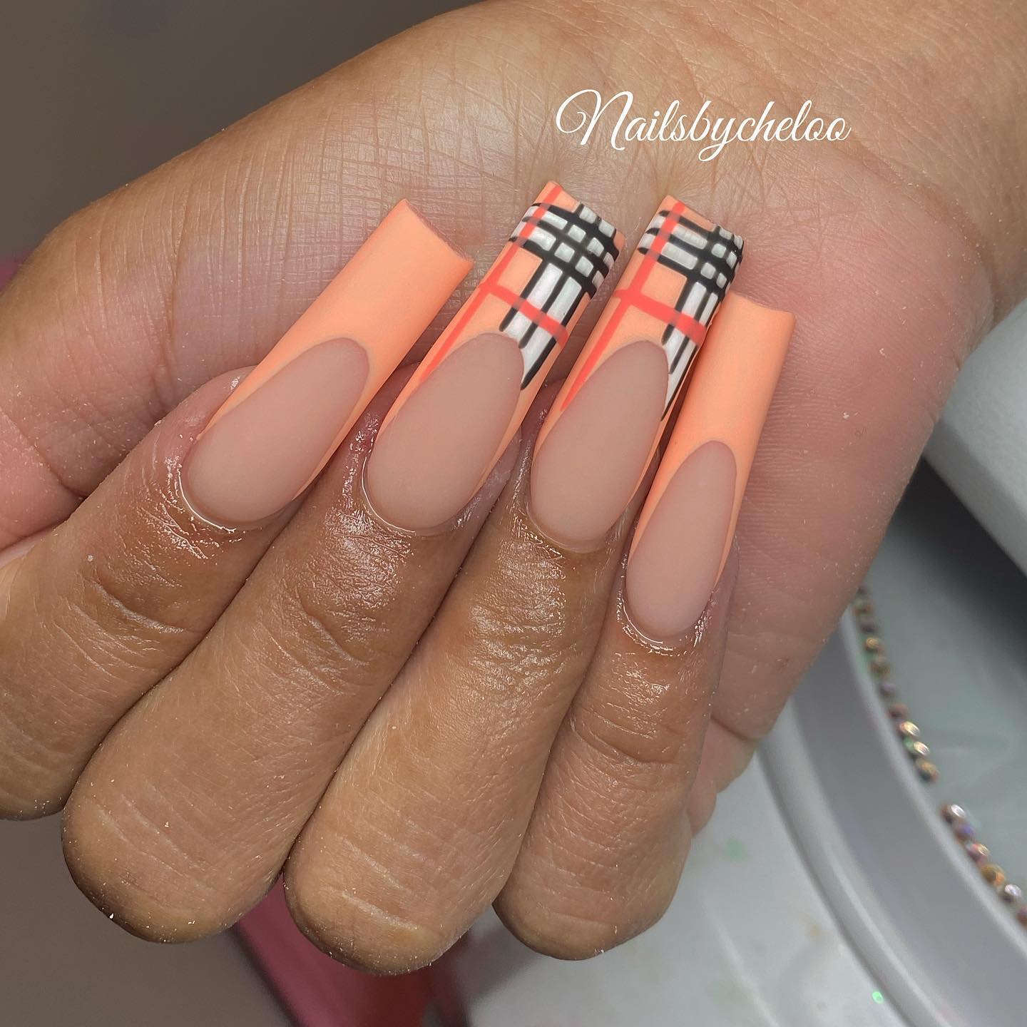 Artistic Orange and Black Patterned Nails