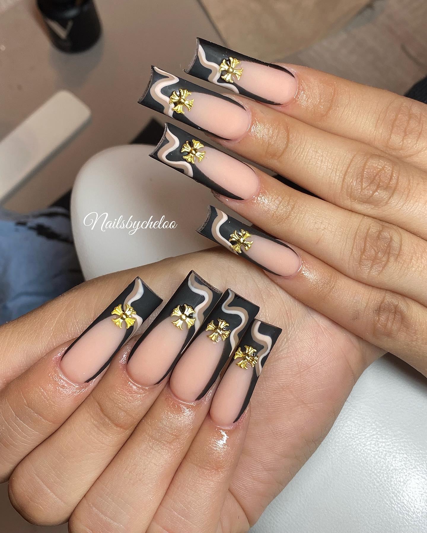 Elegant Black and Nude Floral Nail Design