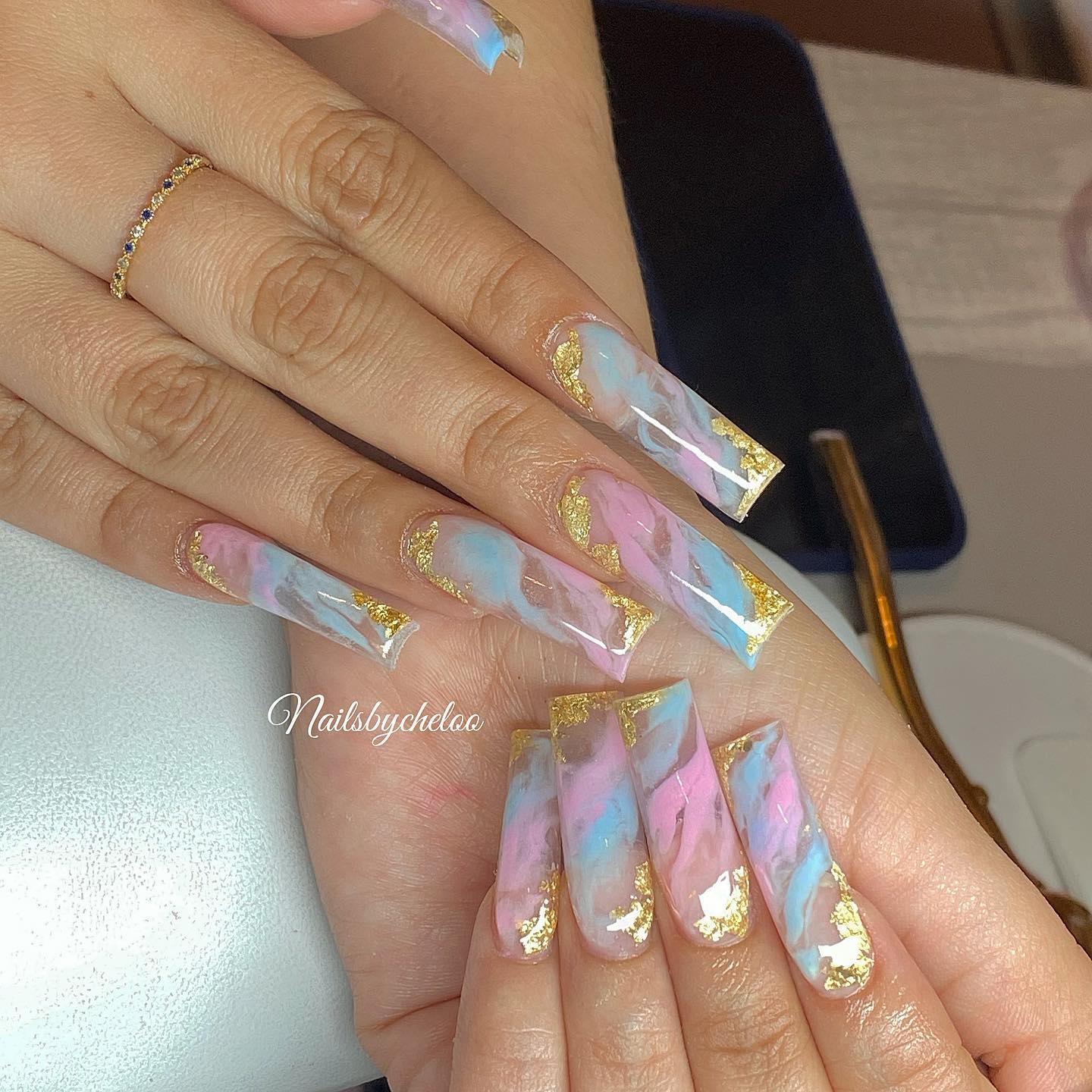 Artistic Marbled Nails with Gold Accents