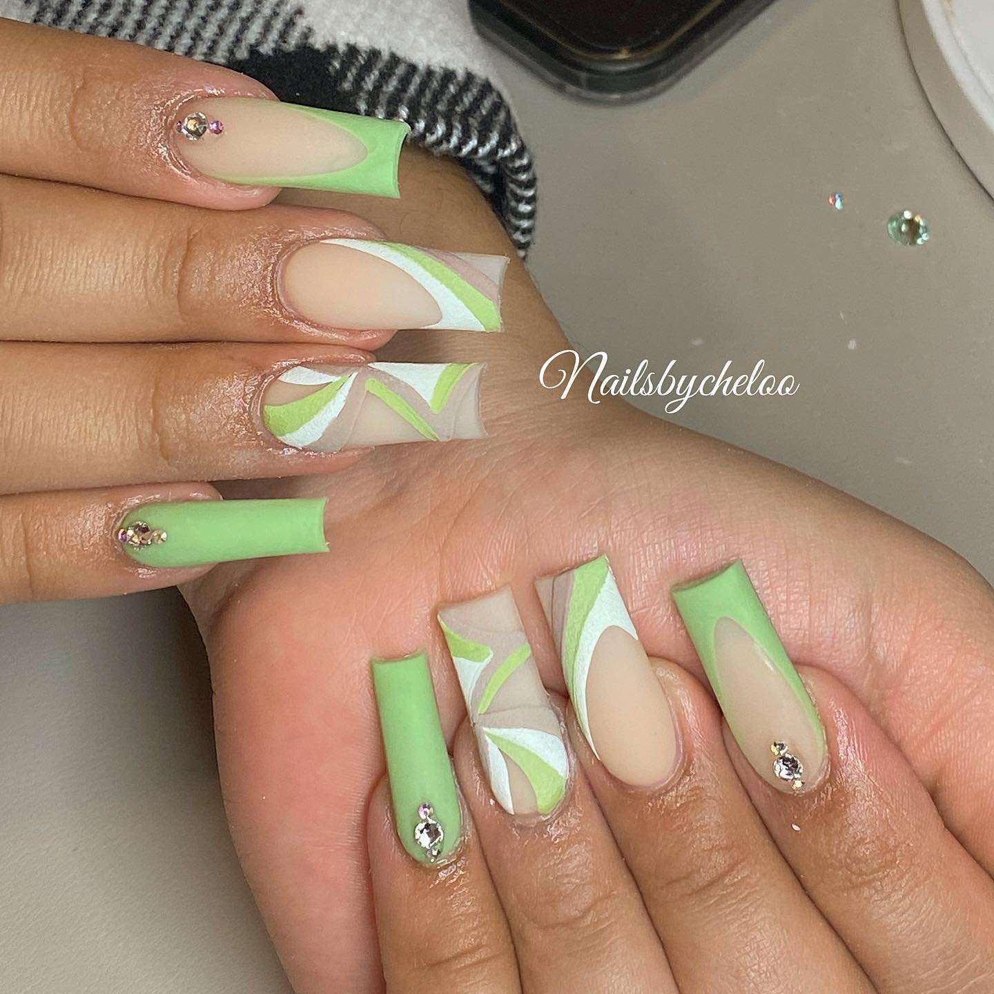 Artistic Green and Nude Nail Design