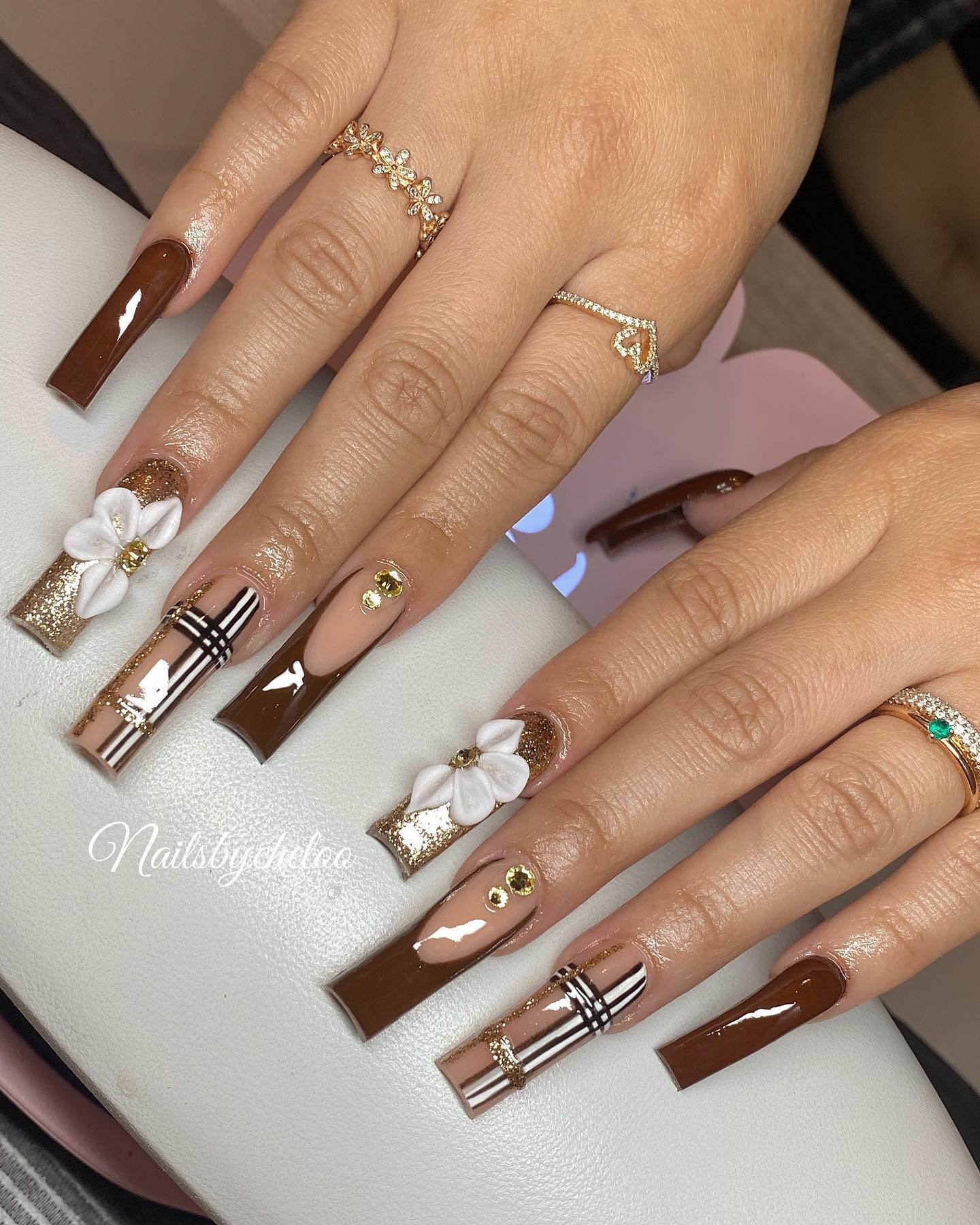 Elegant Brown and Nude Nails with Floral Accents