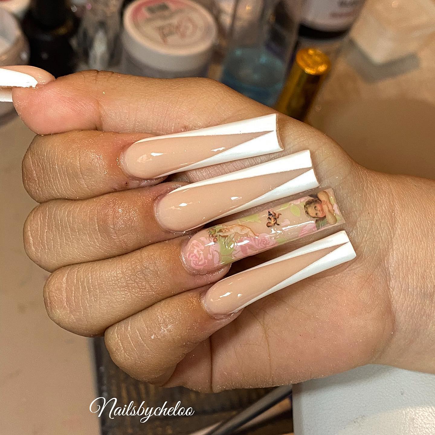 Elegant Nude and White Nails with Artistic Design