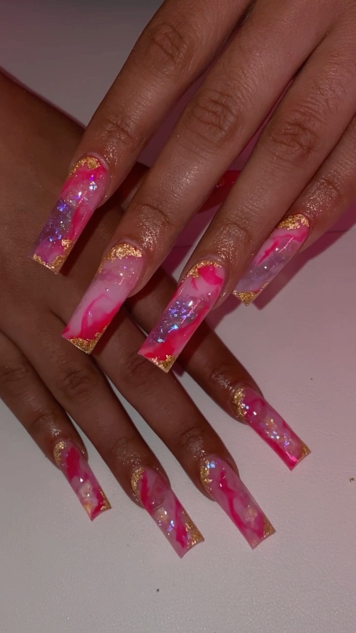 Artistic Pink and White Marble Nails with Gold Accents