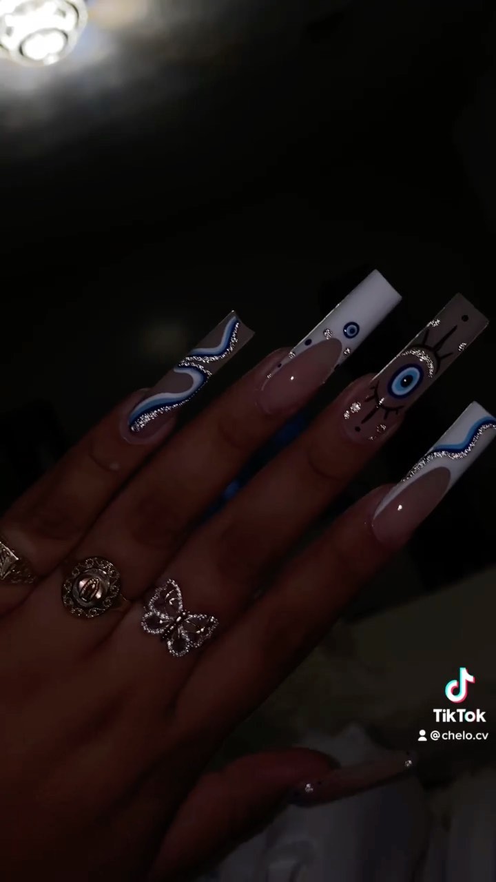 Artistic Blue and Nude Nails with Eye Design