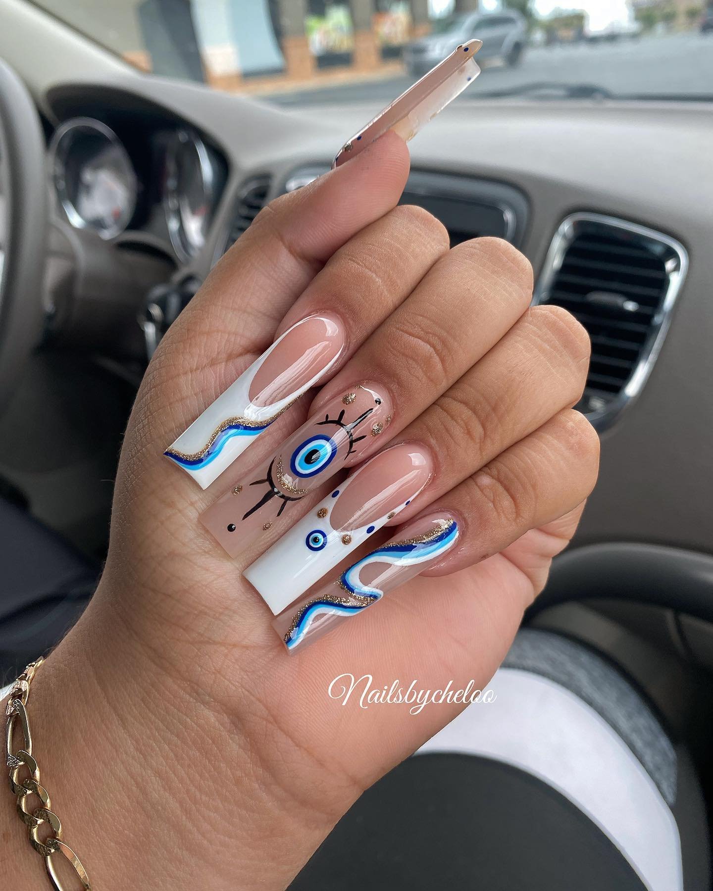 Artistic Nail Design with Blue Accents