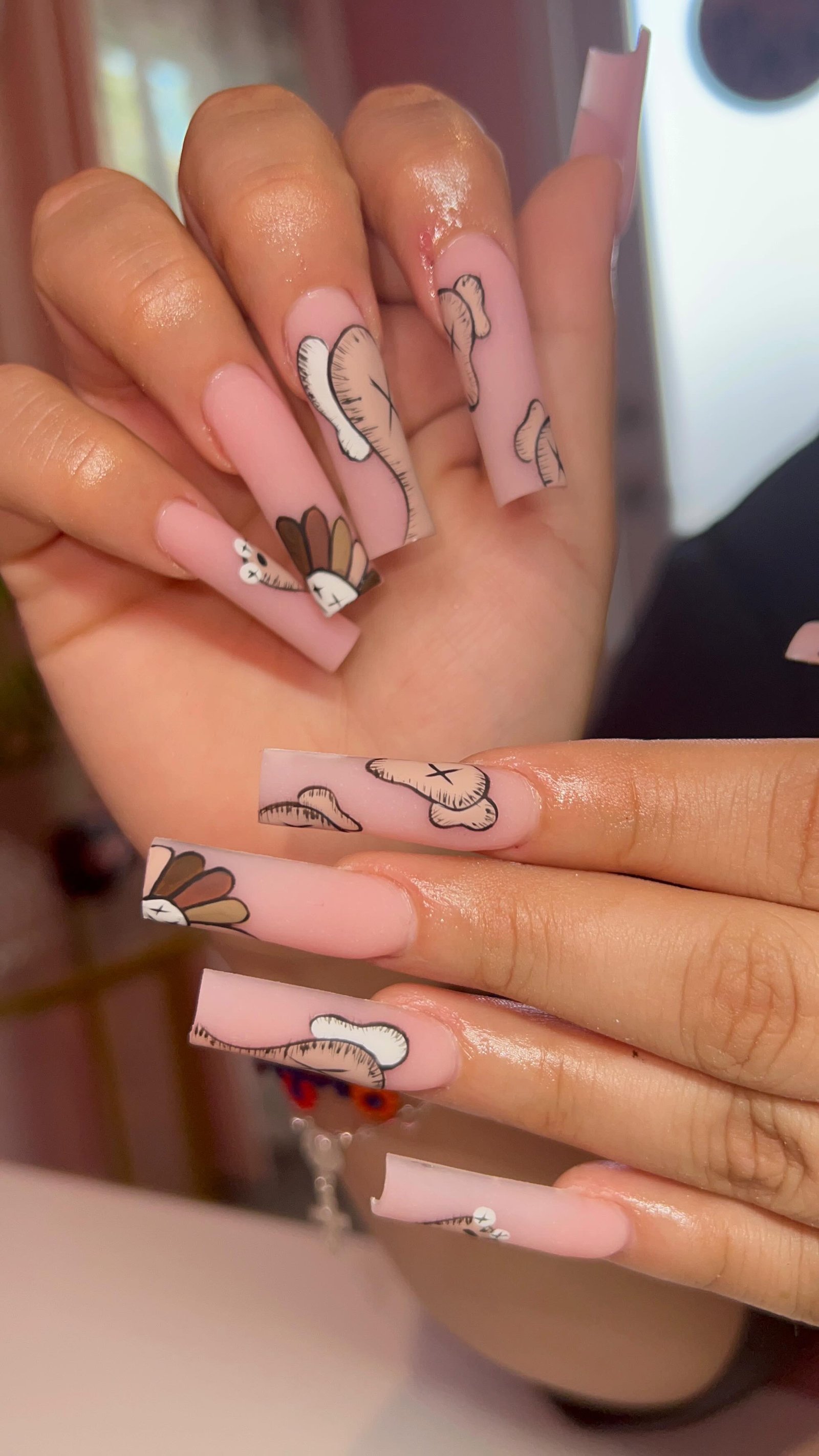 Artistic Pink Nails with Fun Designs