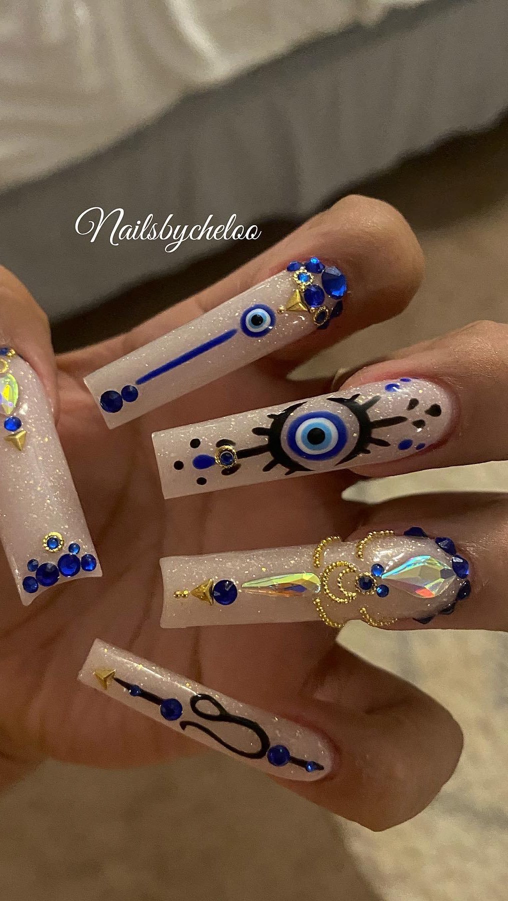 Artistic Blue and Nude Nails with Rhinestones