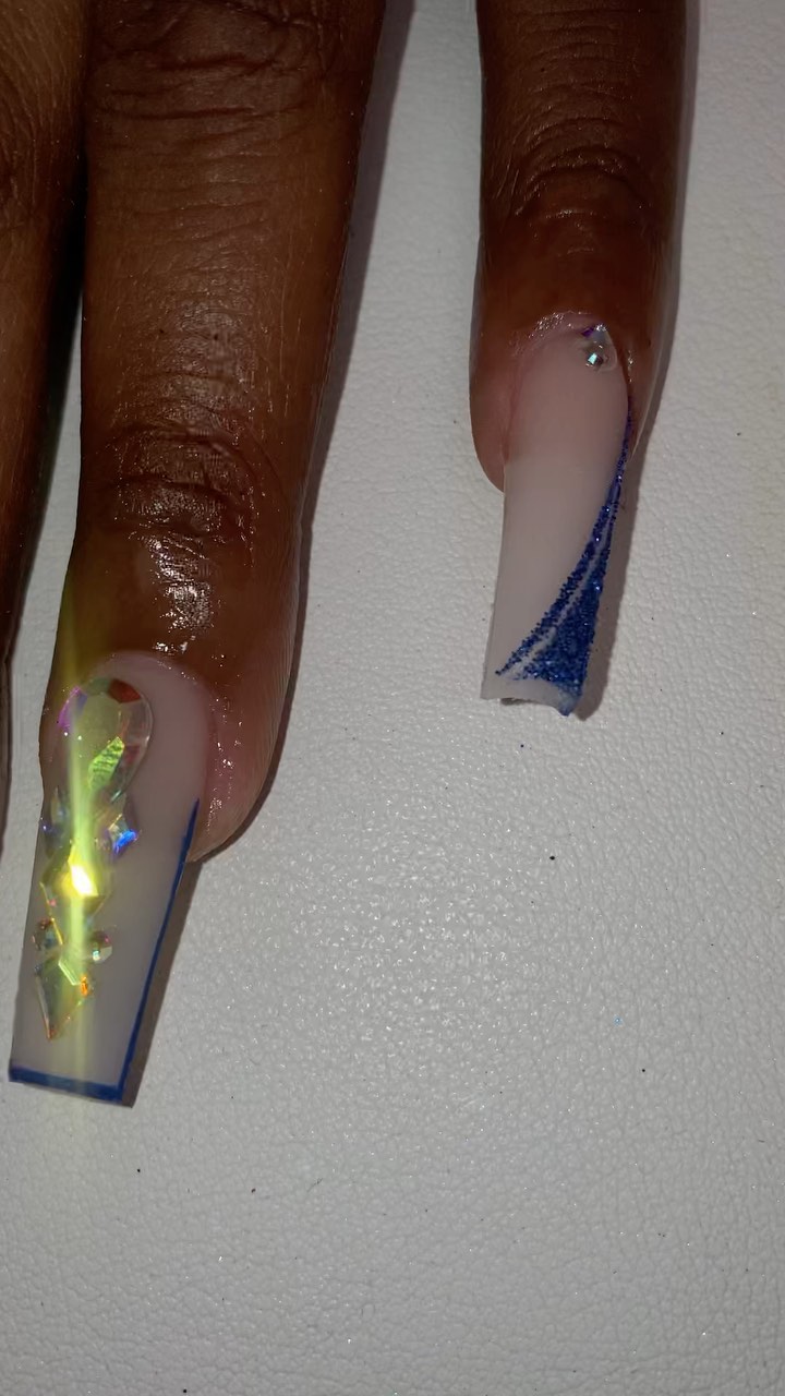 Artistic Nude and Blue Nail Design