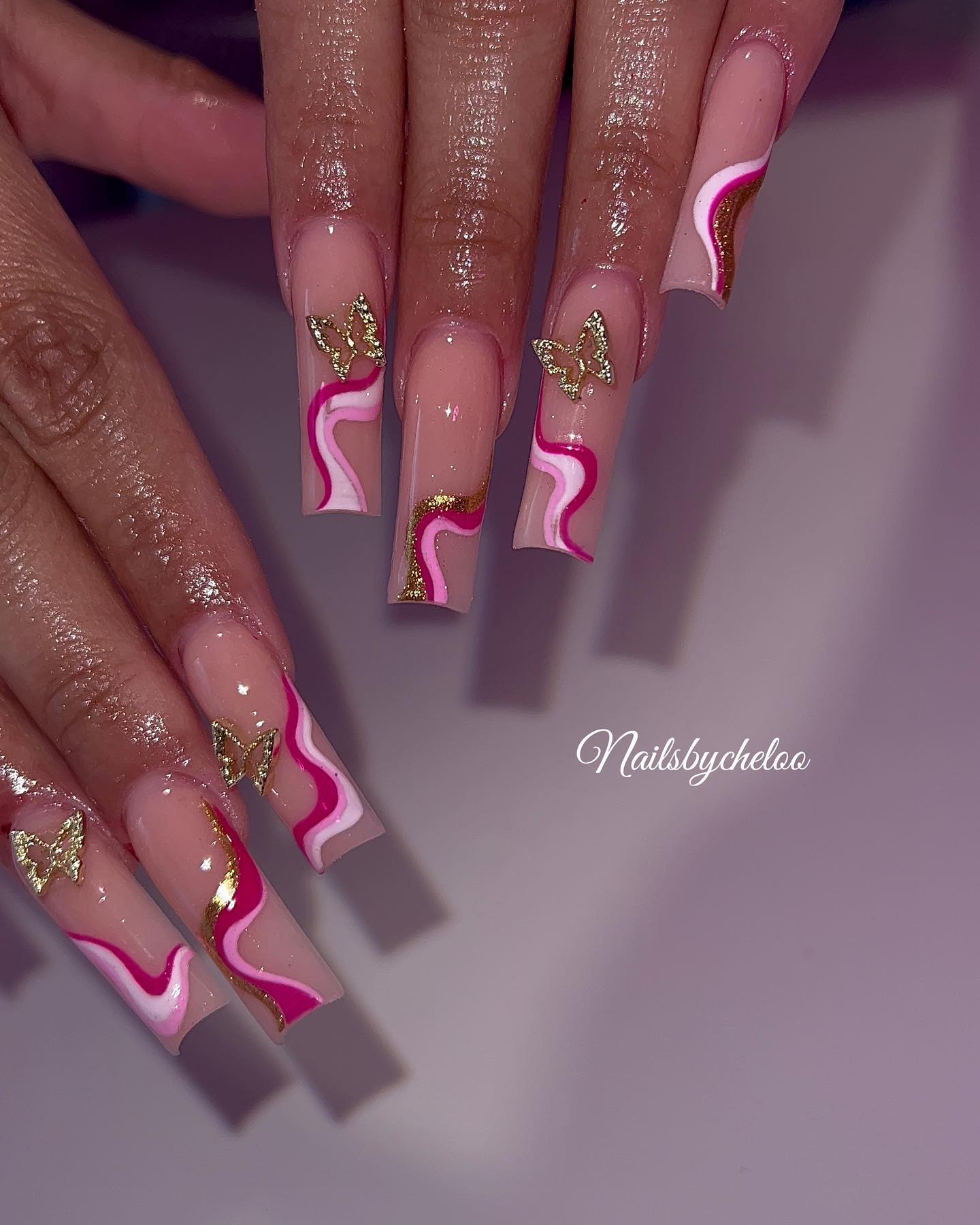 Artistic Pink and Gold Butterfly Nails