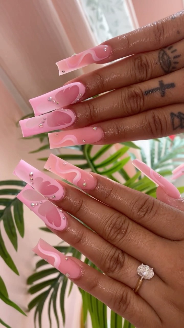 Artistic Pink Nail Design with Rhinestones
