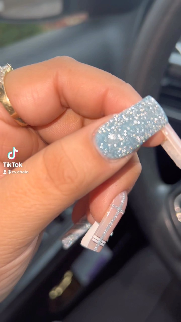 Glittery Blue and Artistic Nude Nails