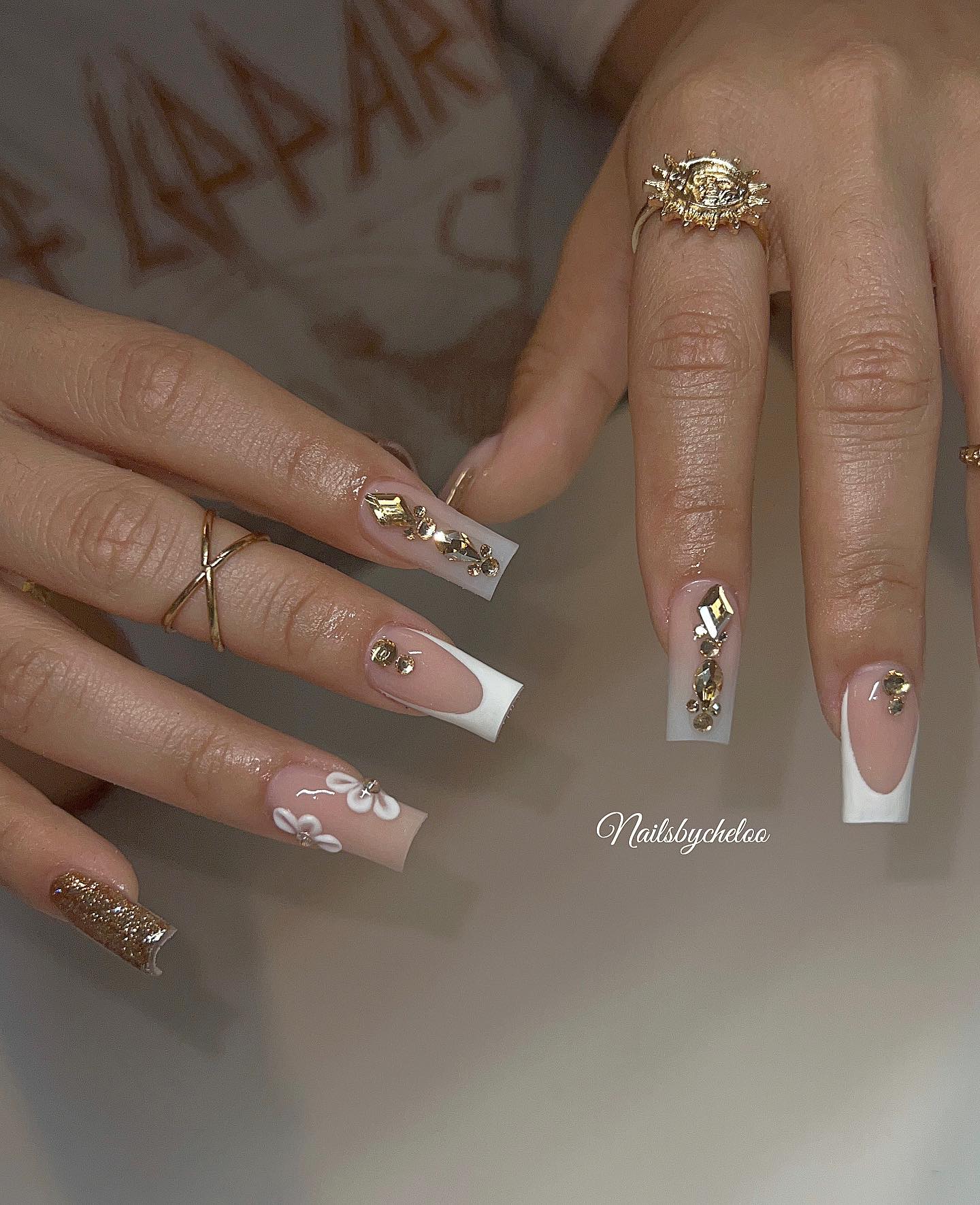 Elegant Nail Art with Gems and Flowers