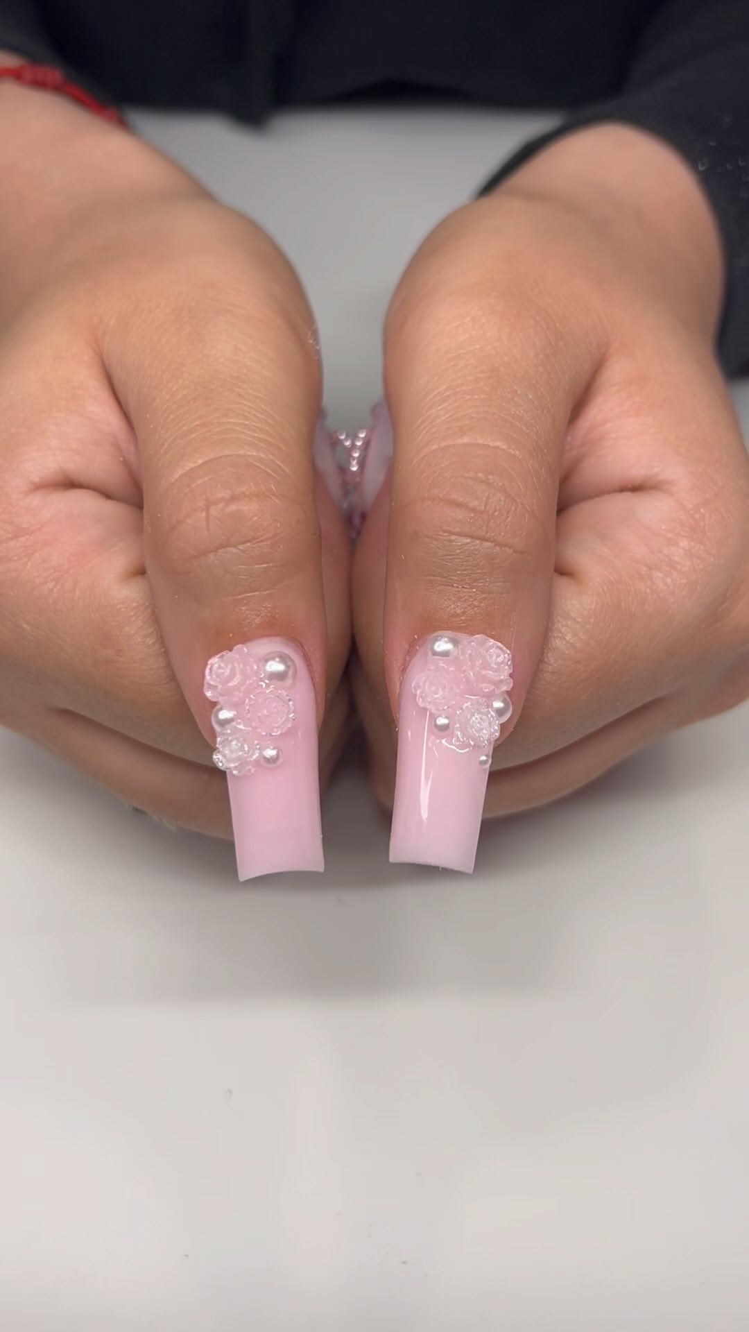 Elegant Pink Nail Design with Floral Accents