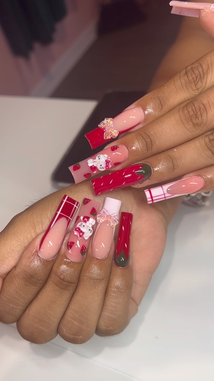 Festive Holiday Nails with Patterns and Charms