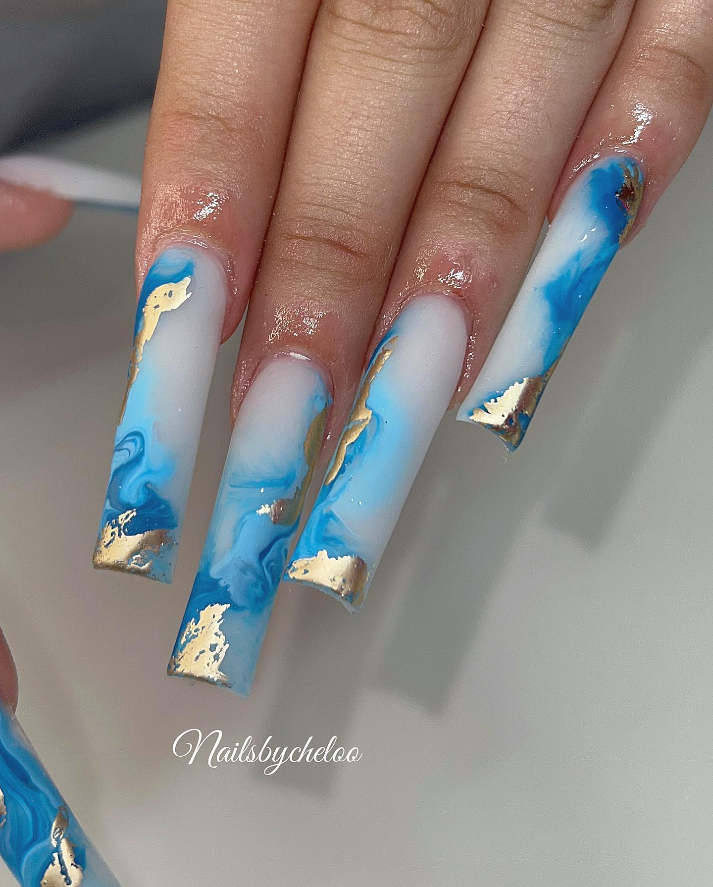 Artistic Blue and Gold Nails