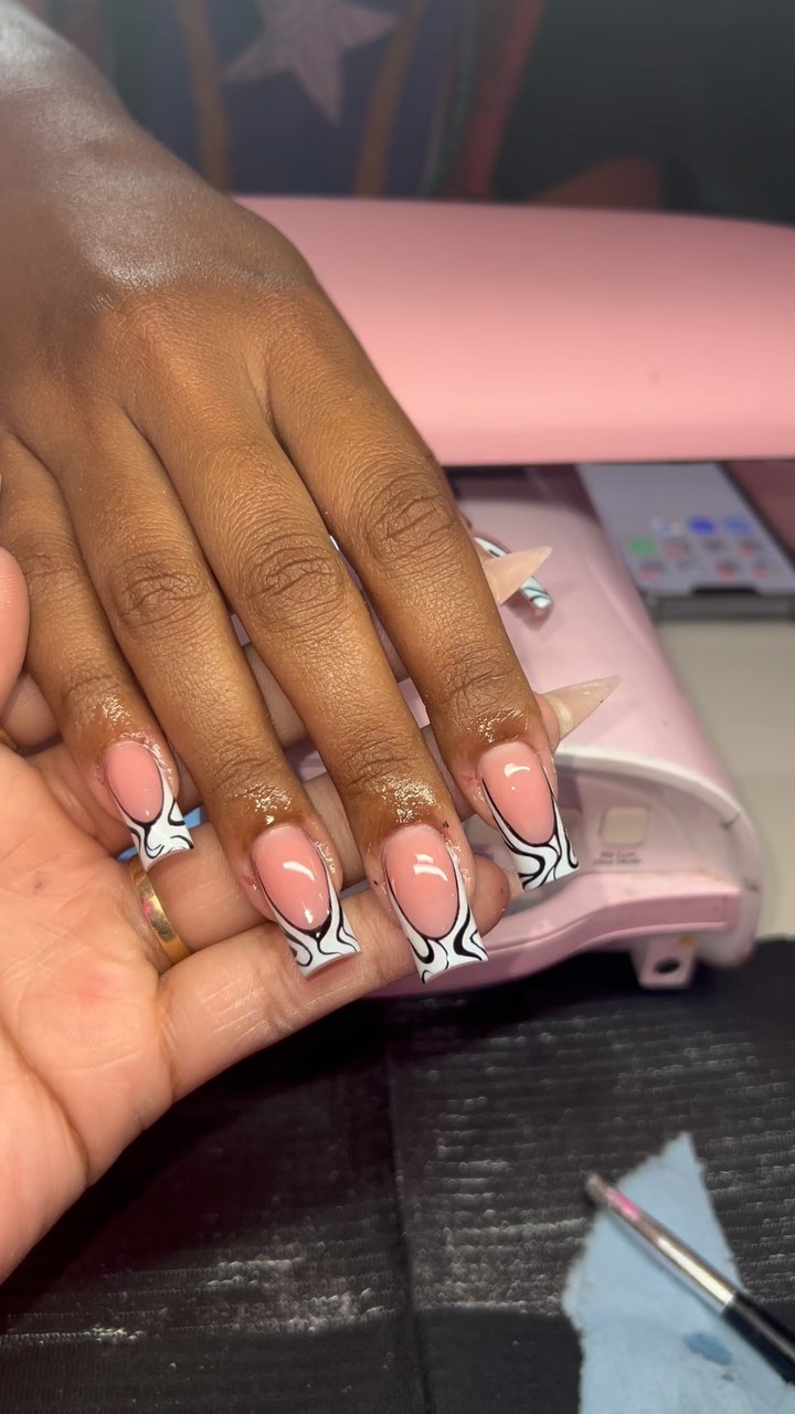 Stylish Nail Art with Black Patterns