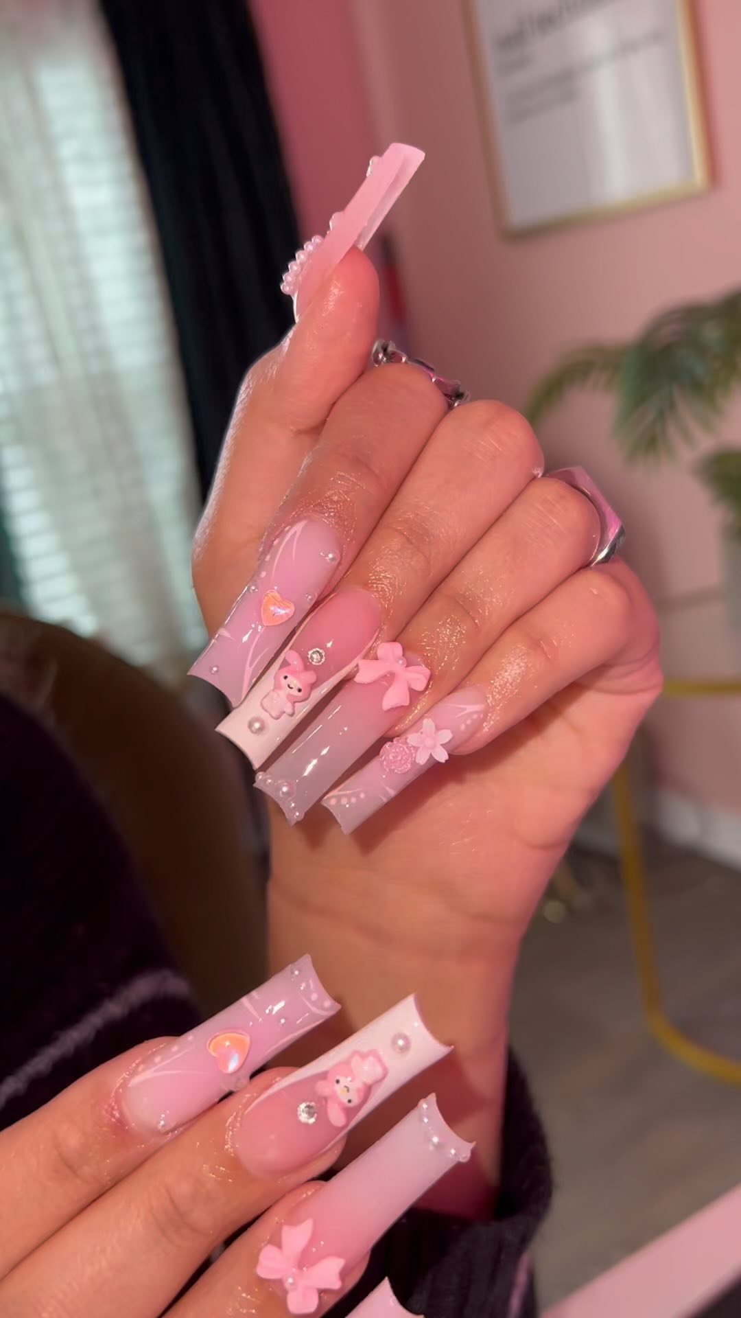 Stylish Pink Nail Art with Charms