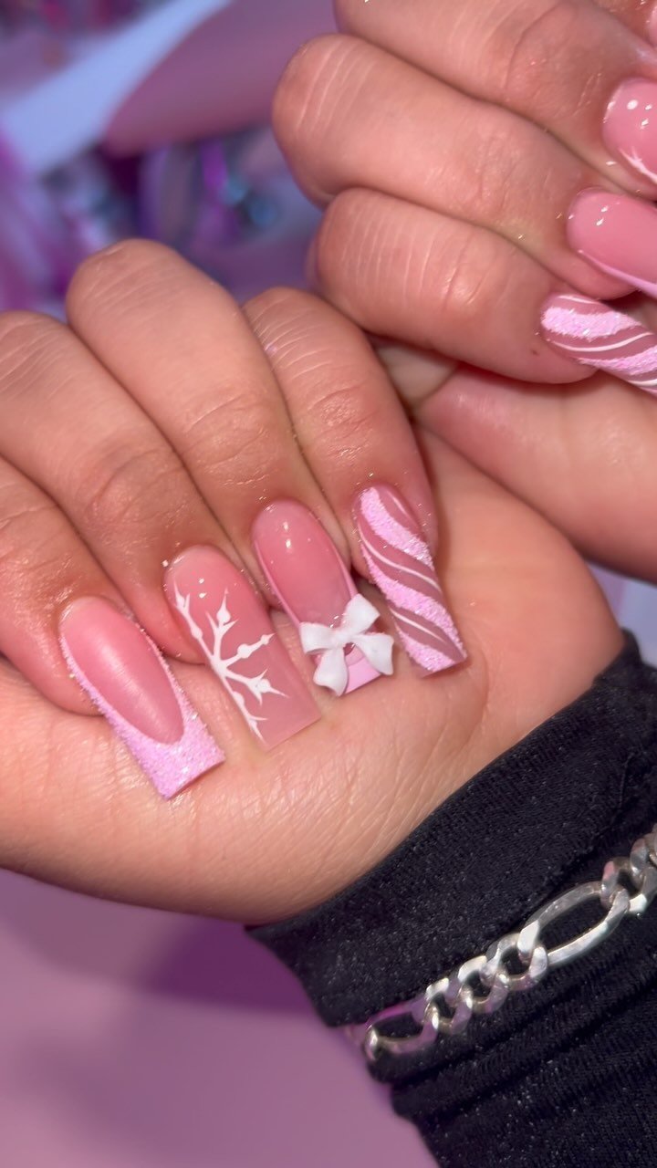 Stylish Pink Themed Nails with Artistic Designs