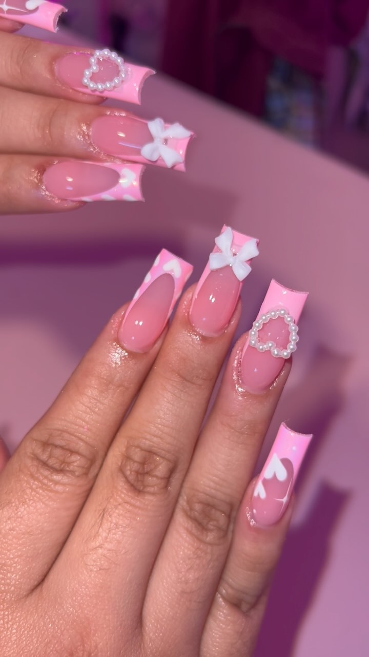 Cute Pink Nail Art with Bows and Pearls
