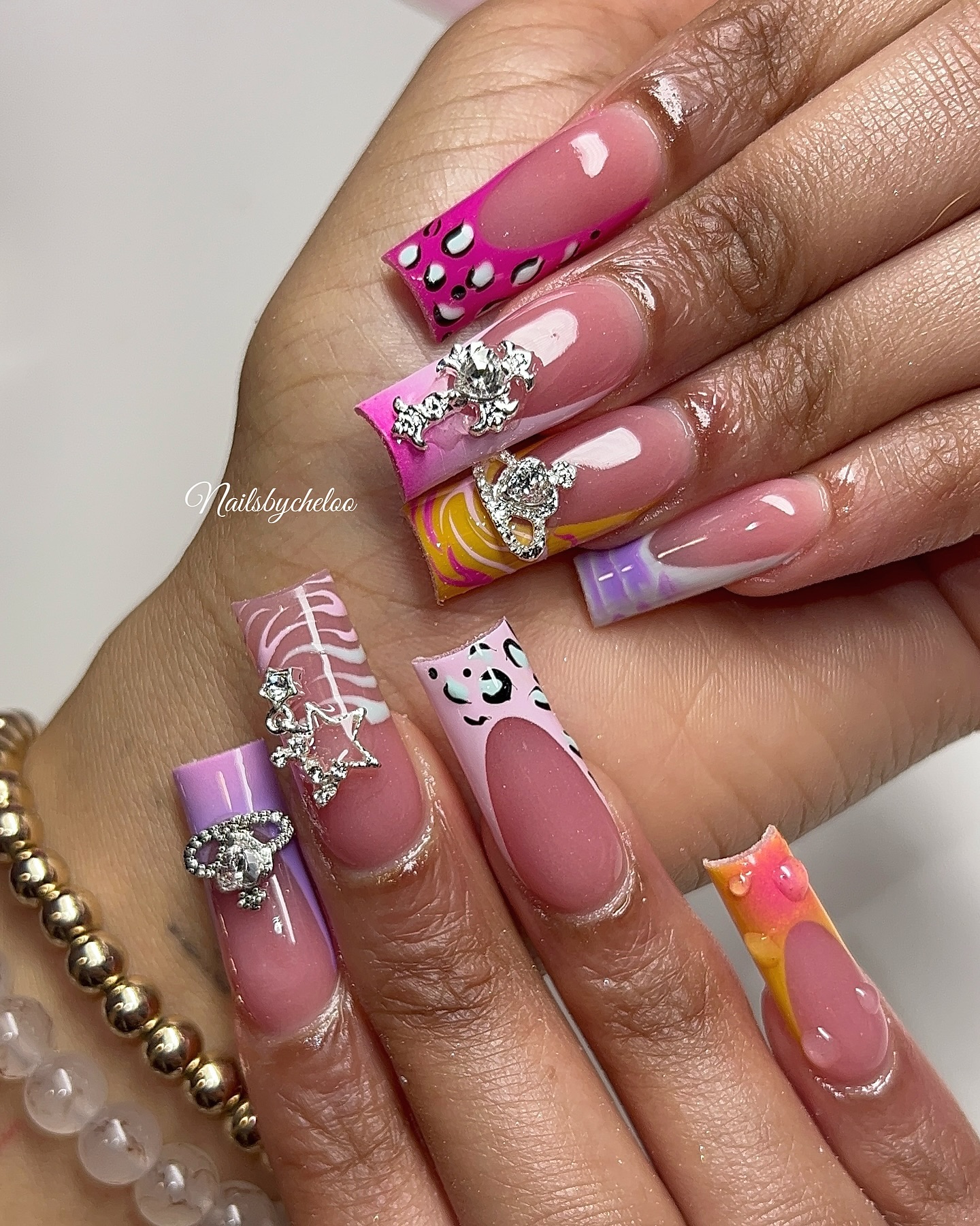 Colorful Artistic Nail Design with Gems