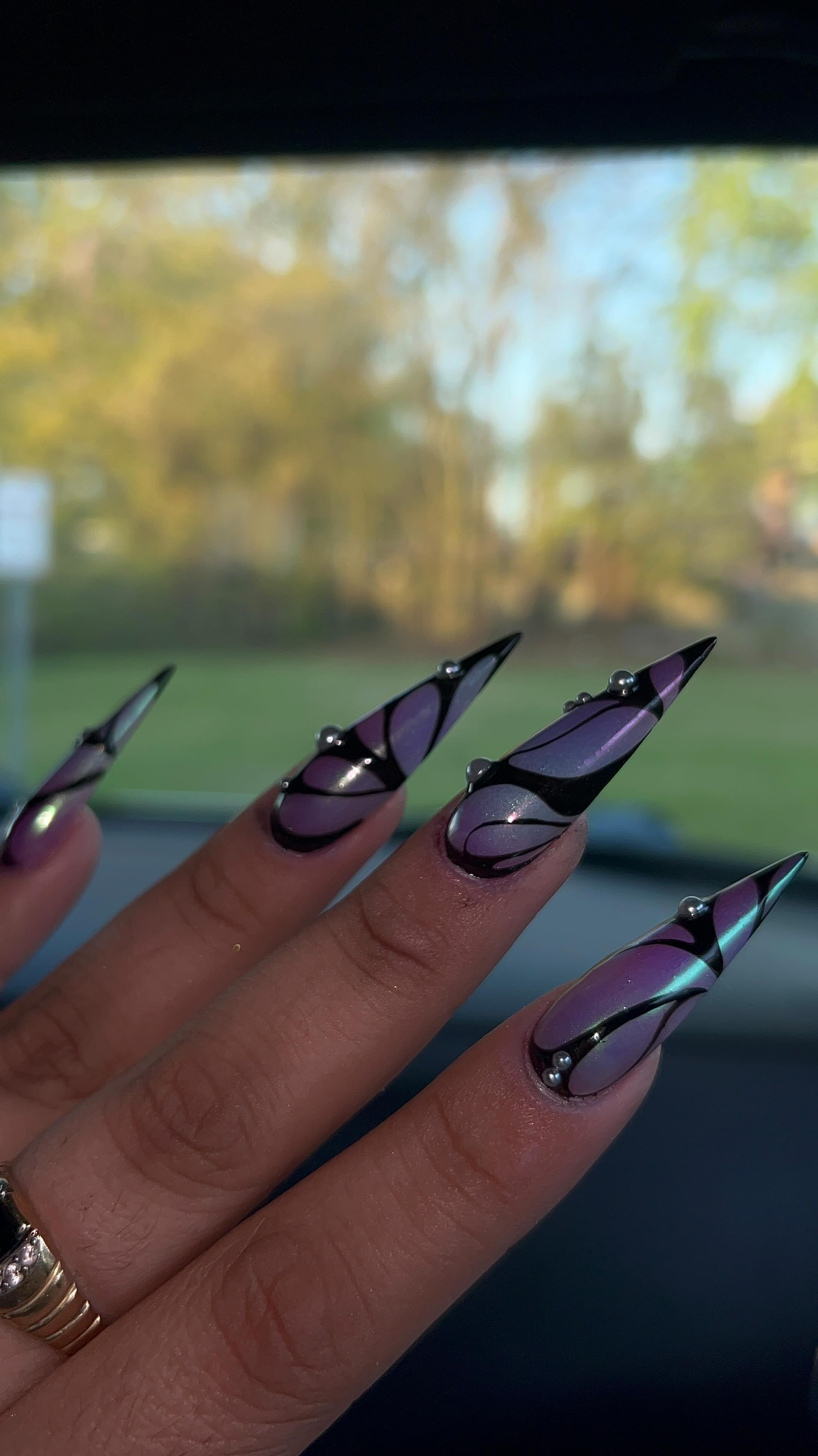 Artistic Stiletto Nails with Gems