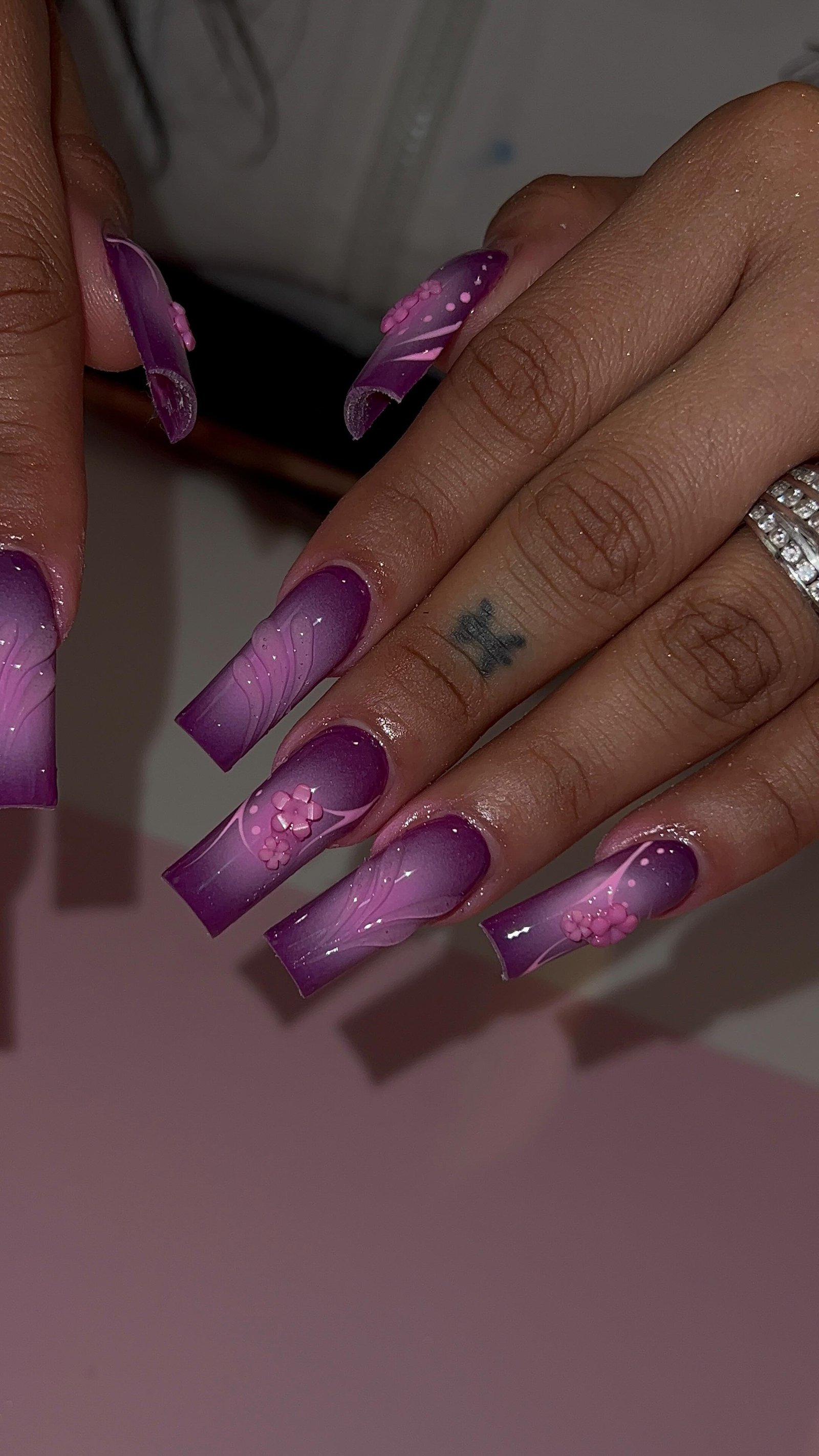 Artistic Purple Ombre Nails with Flowers