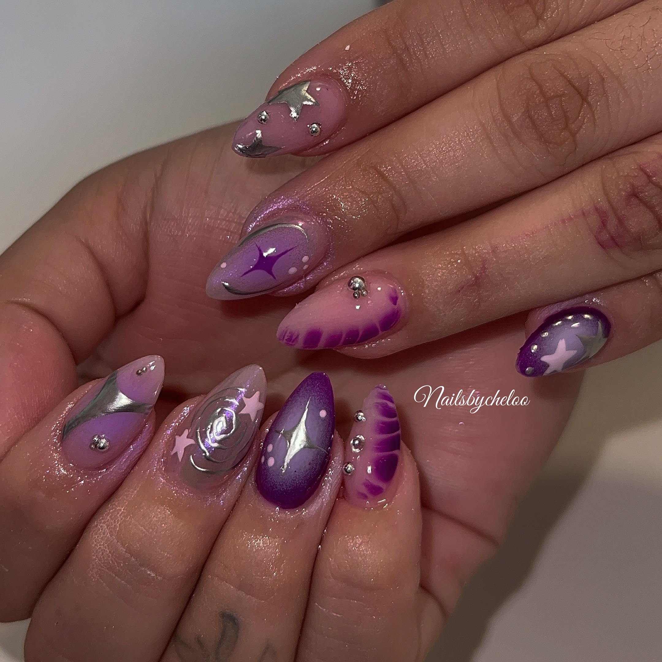 Artistic Purple and Silver Nails