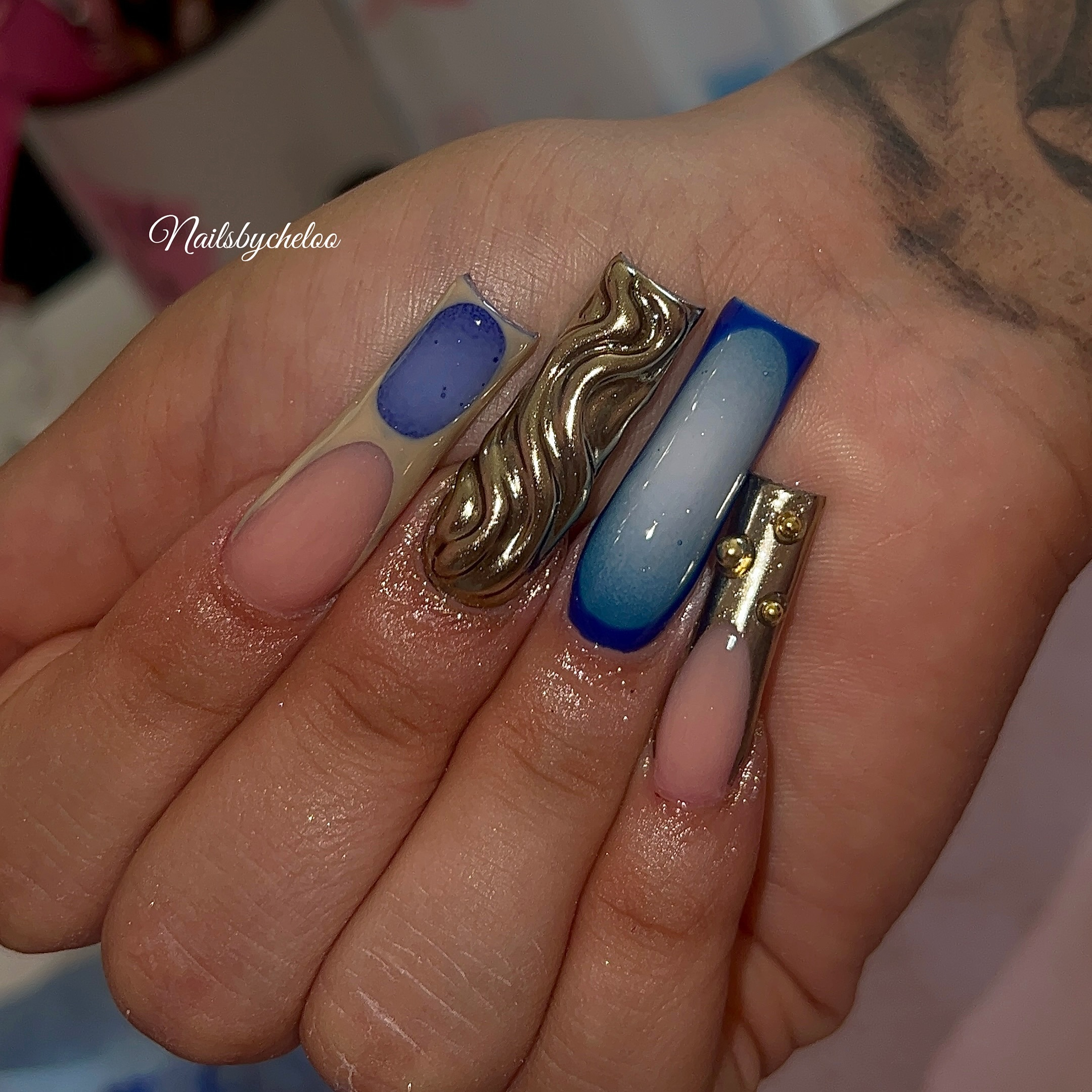 Artistic Blue and Gold Nails