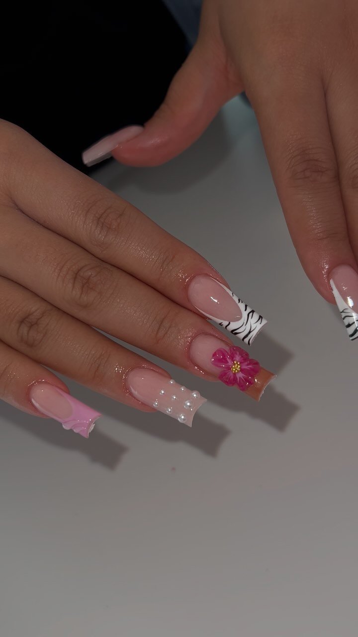 Artistic Floral and Zebra Nail Design
