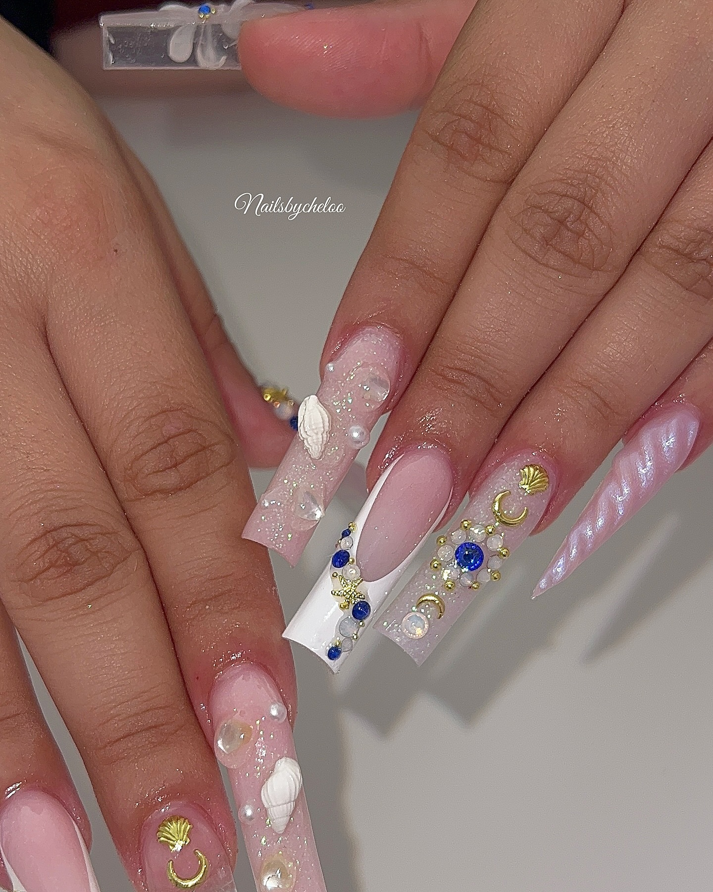 Artistic Nude Nails with Gems and Charms