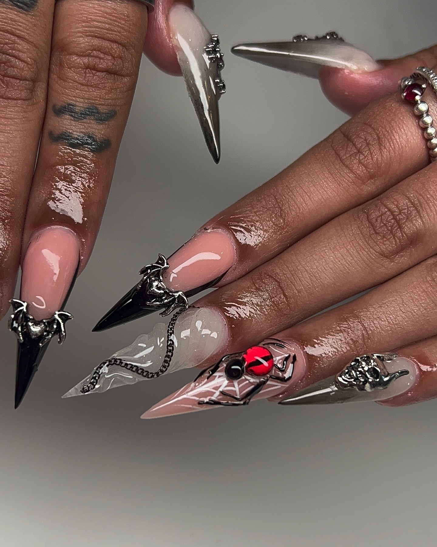 Artistic Stiletto Nails with Charms