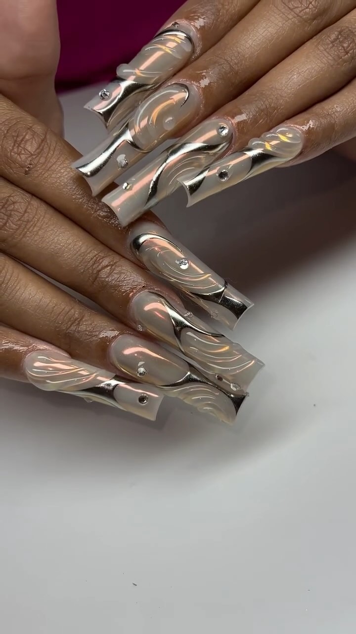 Artistic Silver and Nude Nail Design