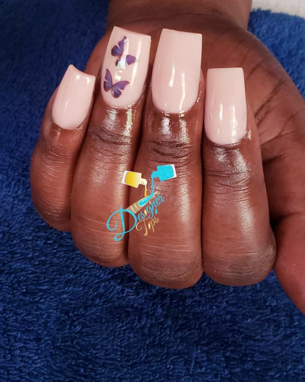 Elegant Nude Nails with Butterfly Design